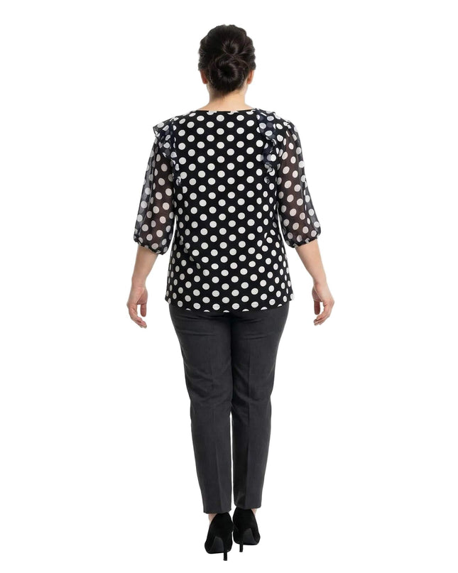 Πίσω όψη της επίσημης γυναικείας σκούρας μπλε τουνίκ με λευκό πουά σε μεγάλα μεγέθη. Διακρίνεται η εβαζέ γραμμή και τα διάφανα μανίκια από σιφόν.