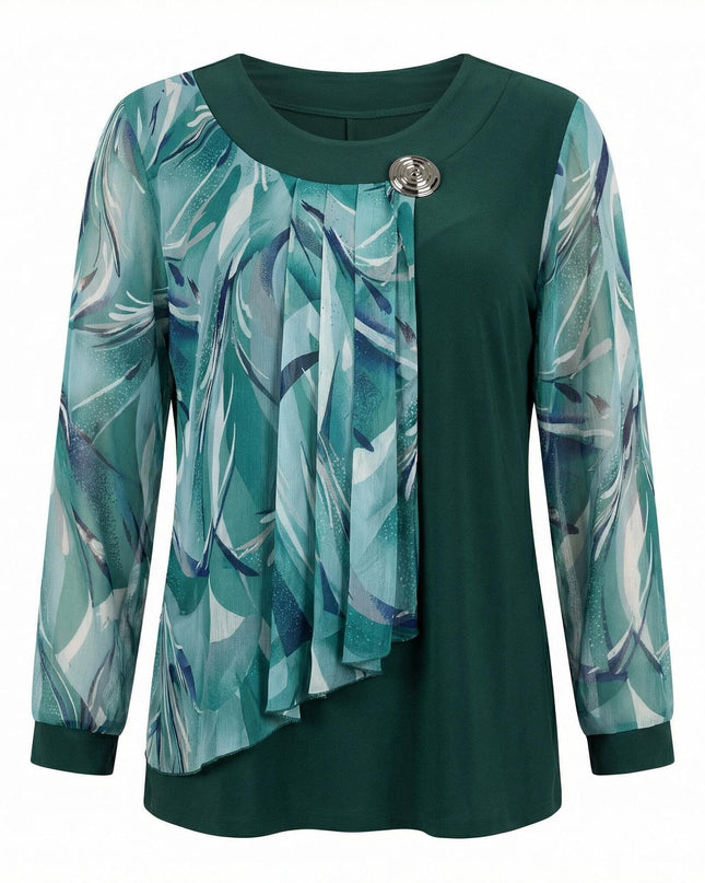 Επίσημη τουνίκ μεγάλα μεγέθη σε λαδί χρώμα, με ασύμμετρο φλοράλ σιφόν και διακοσμητική καρφίτσα στο ντεκολτέ, σε μπροστινή όψη και λευκό φόντο.